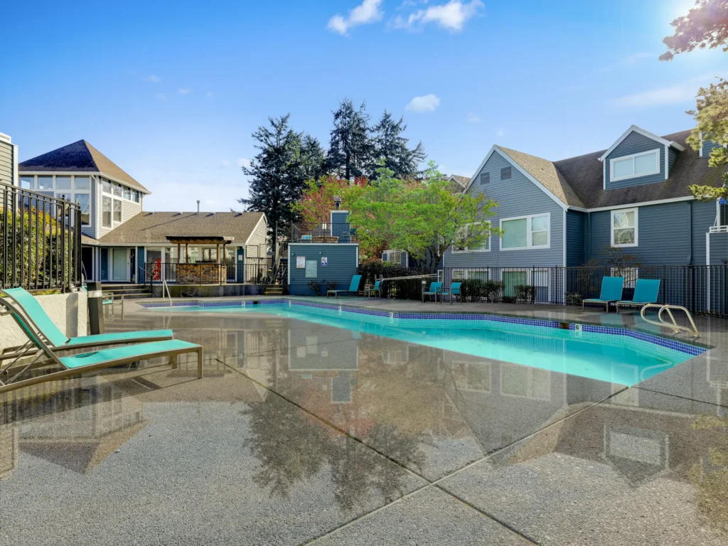 Pool with deck seating at Meadows at Cascade Park apartment rentals in Vancouver