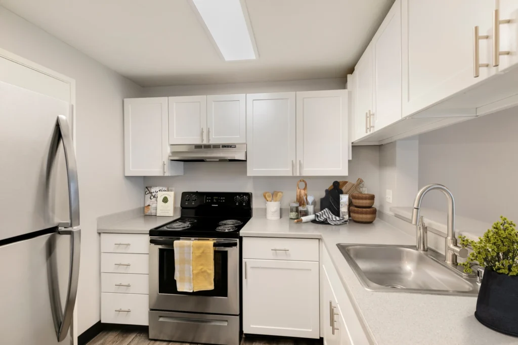 Kitchen with stainless steel appliances at Meadows at Cascade Park apartments in Vancouver